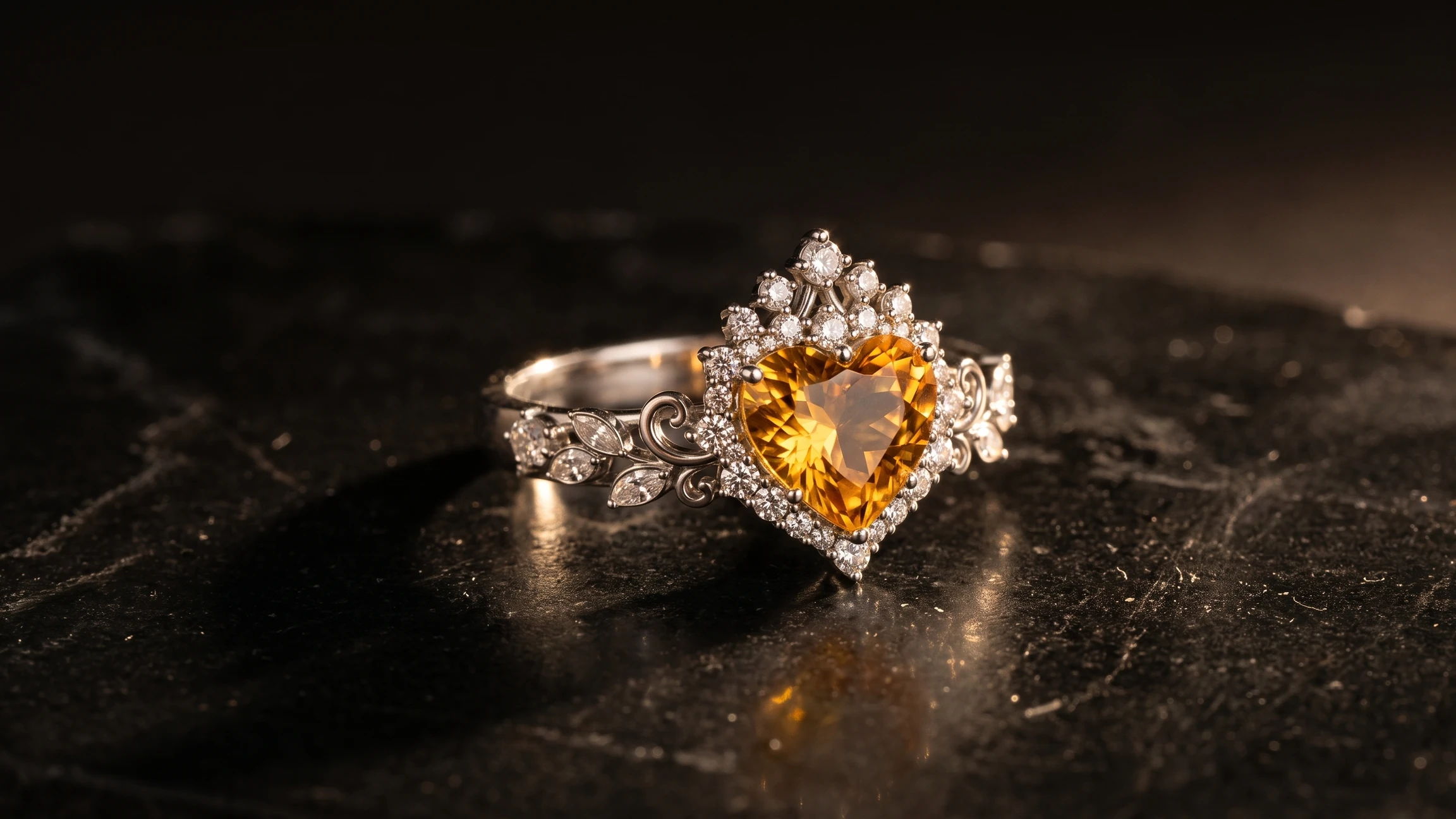 A heart-shaped amber-coloured ring lit on a dark mineral surface